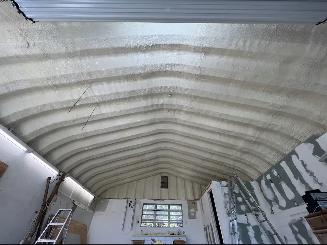 Spray polyurethane foam applied to the underside of a metal roof deck in Hurley